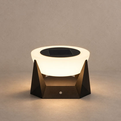 NOCTARA solar outdoor lamp with a glowing round diffuser and dark angular base on mushroom taupe