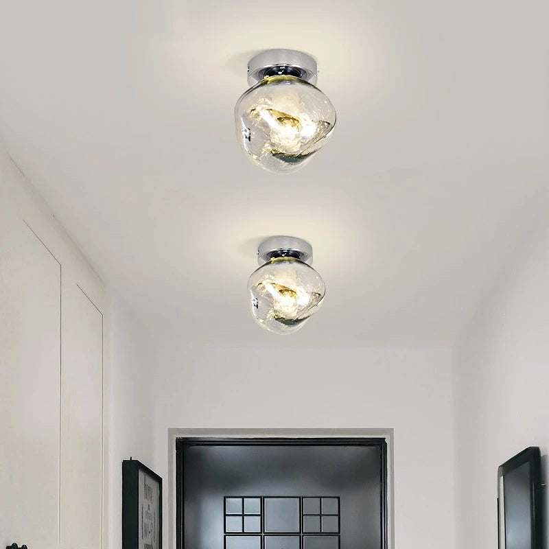LAVA WALL two chrome lights mounted on a hallway ceiling