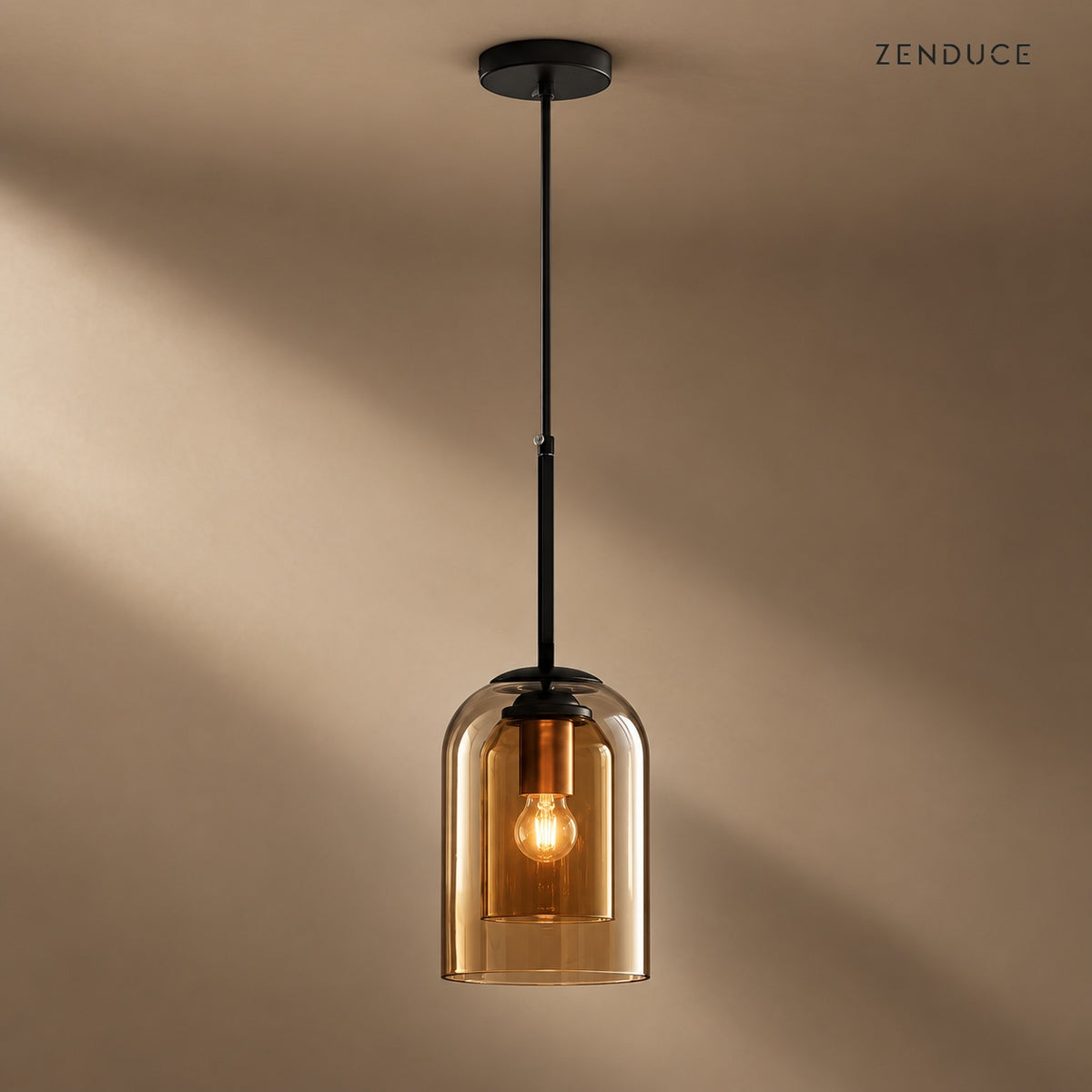 MAELLE Amber double-glass pendant with black canopy on a mushroom taupe background