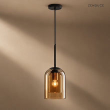 MAELLE Amber double-glass pendant with black canopy on a mushroom taupe background