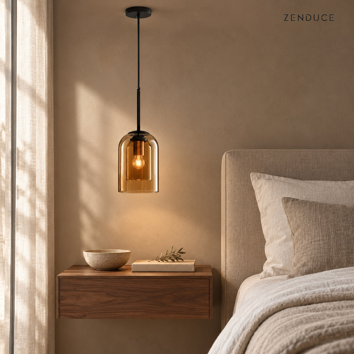MAELLE Amber pendant beside a linen bed and floating walnut nightstand