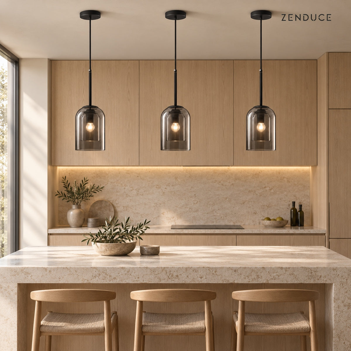 Three MAELLE Smoky Gray pendants above a stone kitchen island; each sold individually