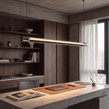 Widest NOXVARE linear pendant isolated against gray, showing its extended glossy-black bar.