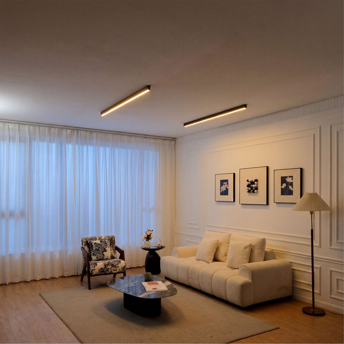 LUNIVA linear ceiling lights in an offset angled arrangement above neutral seating.