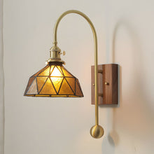 ARLETTE - Amber cone glass wall sconce with brass arm and walnut backplate