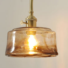 ARLETTE - Close view of the amber round rippled glass shade