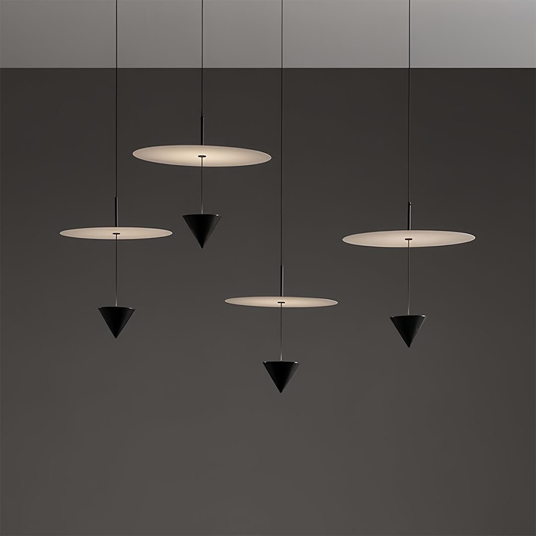 CONIA - Multiple white disc and black cone pendants at staggered heights