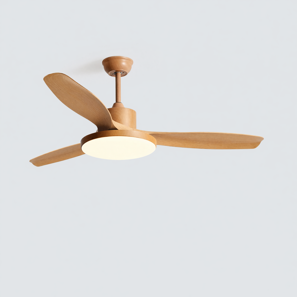 SKAGEN light-wood five-blade ceiling fan isolated with its round center light switched on.