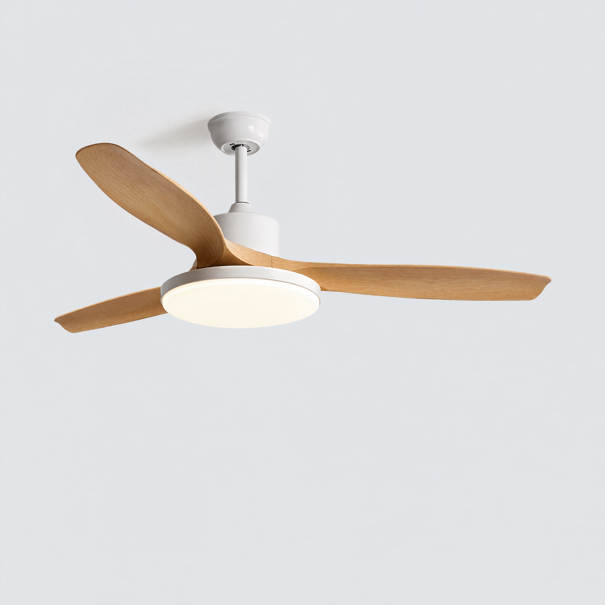 White SKAGEN ceiling fan with wood blades illuminating a calm, warm-toned bedroom.