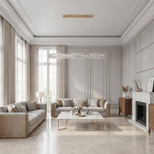 SEVRAYA crystal chandelier in a bright cream living room with sofas and a fireplace