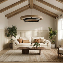 Walnut ORLUNEA chandelier isolated with concentric wood and black rings.