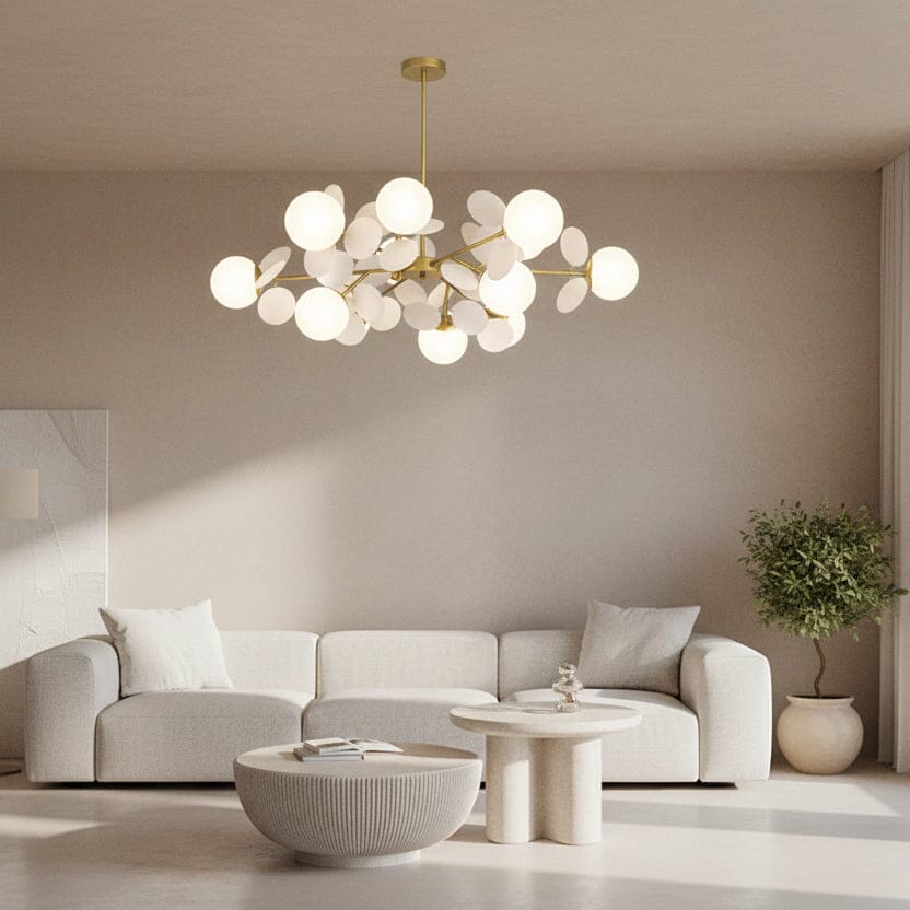 Modern living room with a stylish chandelier, sofa, and coffee table.