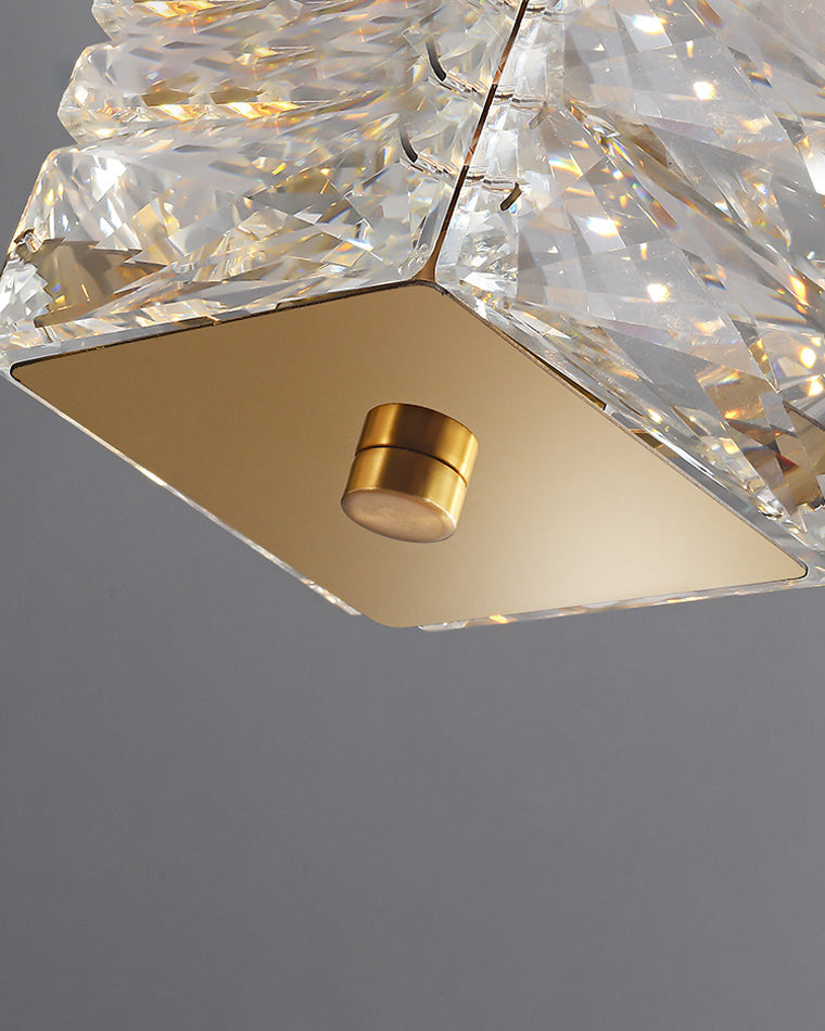 Macro view of SEVRAYA gold square end plate and cylindrical bolt beside faceted crystal