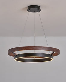 Angled installed view of ORLUNEA’s walnut outer ring and offset black inner ring.