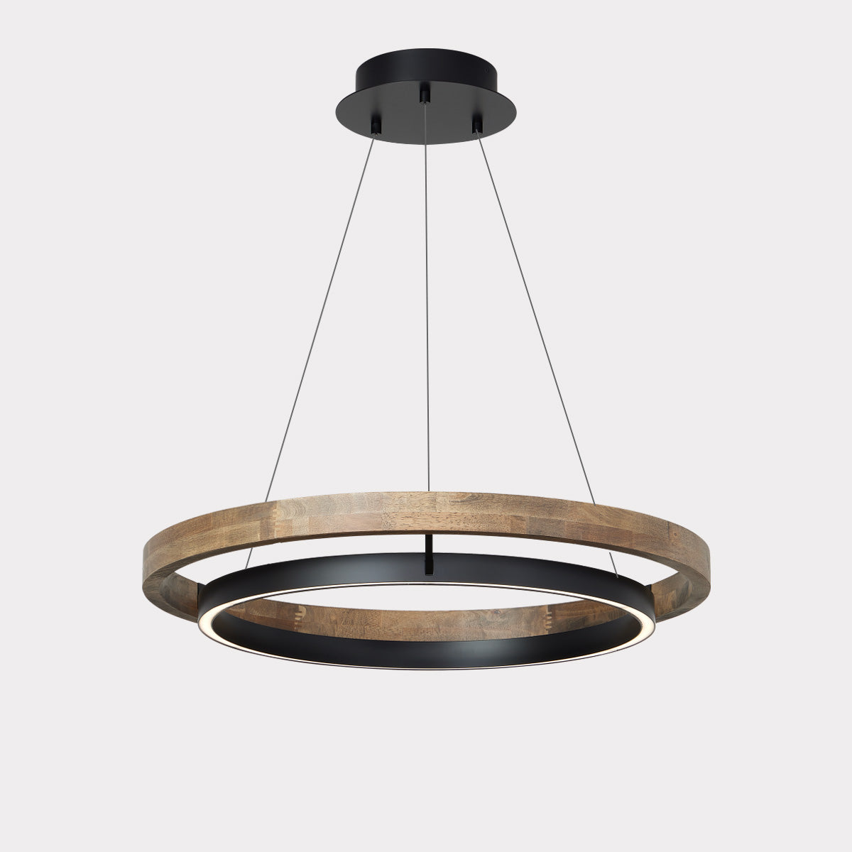 Warm ORLUNEA chandelier centered over a neutral sofa and coffee table.
