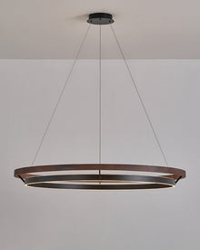 Walnut ORLUNEA chandelier isolated, showing the offset black illuminated ring below.