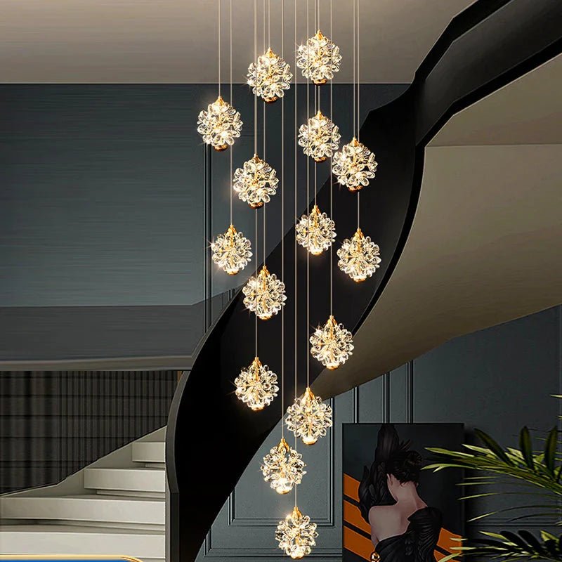 Chandelier with crystal lights hanging in a modern interior setting.