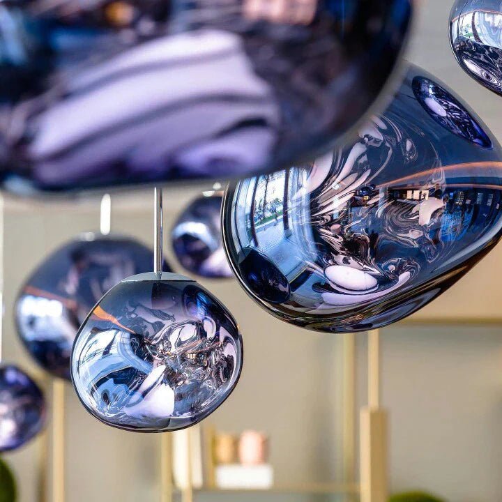 LAVA blue mirrored molten-shape pendants hung at staggered heights
