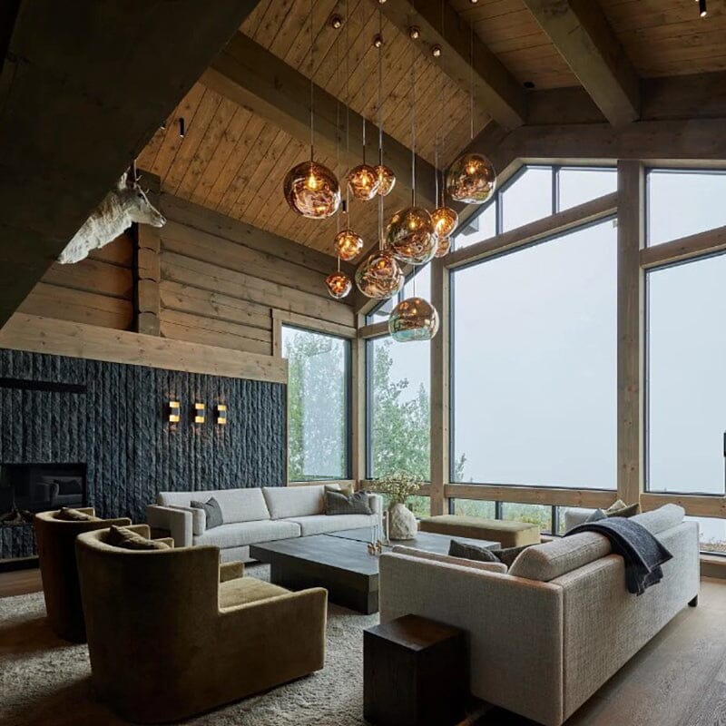 LAVA rose gold pendant cluster under a timber ceiling in a lodge-style lounge