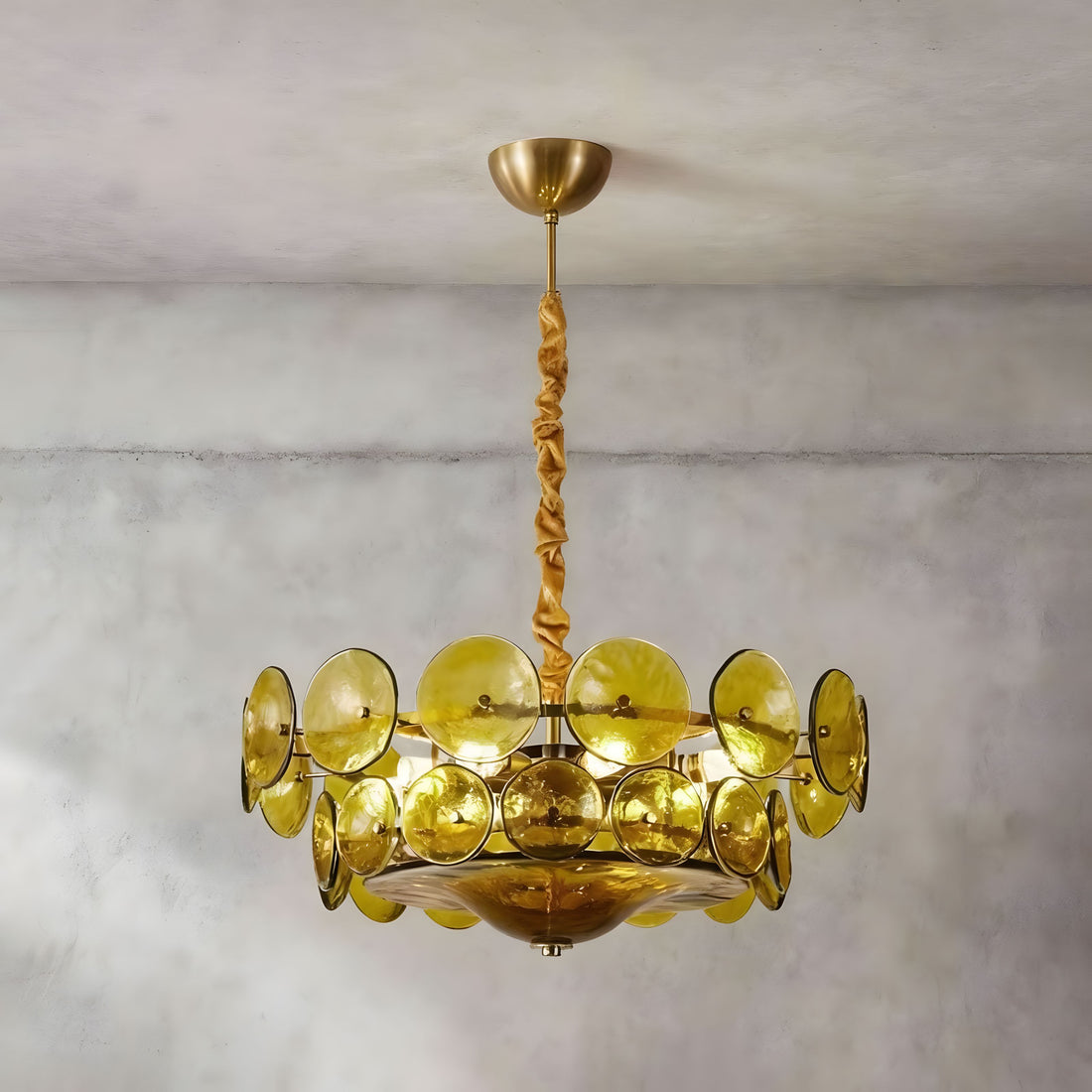 MERIDIAN round chandelier of layered amber glass discs on a gold-finish stem