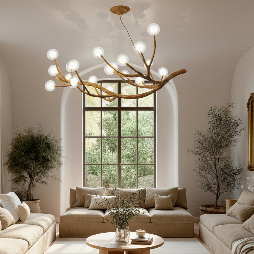 Modern living room with white sofas, a wooden coffee table, and decorative elements.