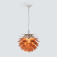 White SYLUNE pine-cone pendant in a modern lounge beside a black-framed divider.