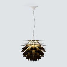 White SYLUNE chandelier illuminating a living room with fireplace and built-in shelves.