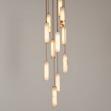 Modern pendant light with glass shades on a gray background