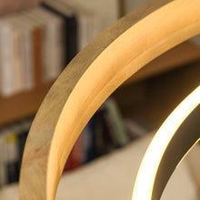 Extra-wide weathered-wood ORLUNEA chandelier isolated with a slim black illuminated ring.