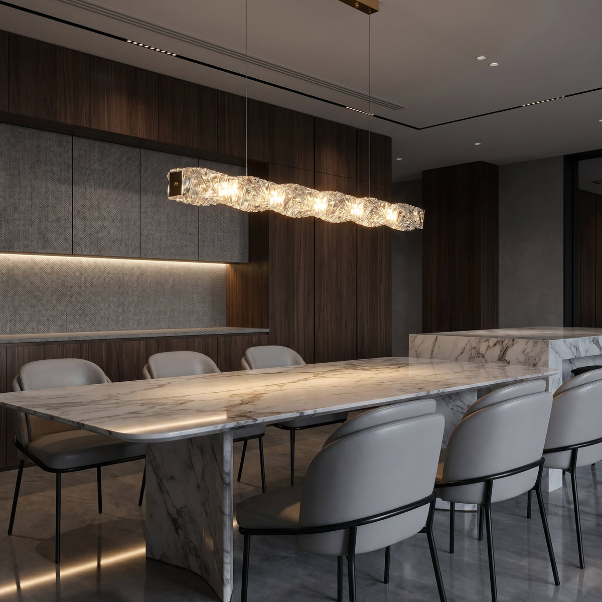 SEVRAYA gold crystal pendant above a long stone dining table in a dark contemporary room