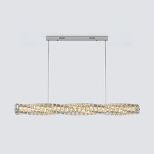 Front view of SEVRAYA with a silver rectangular canopy and warm-lit crystal bar