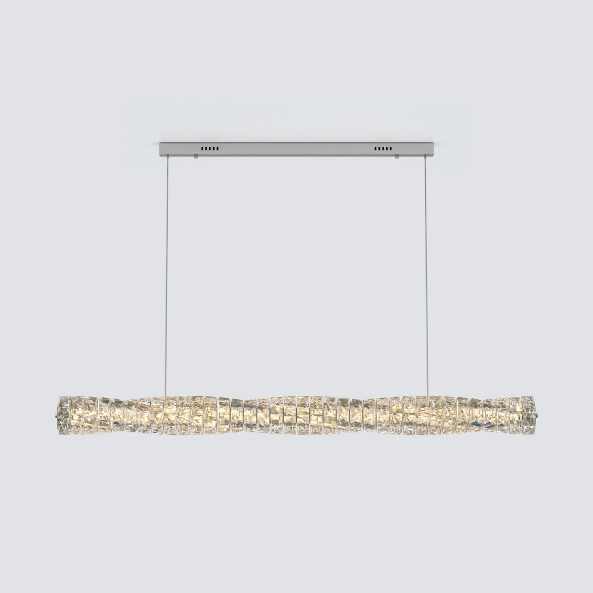 Silver-finish SEVRAYA pendant showing its cable suspension and faceted crystal profile