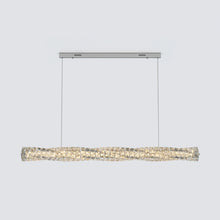 Silver-finish SEVRAYA pendant showing its cable suspension and faceted crystal profile