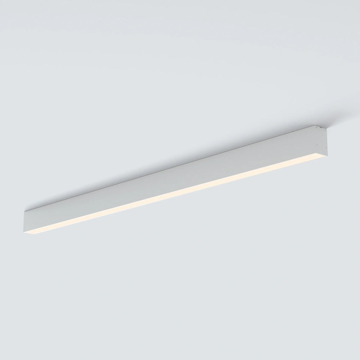 Black LUNIVA linear flush-mount light isolated at an angle on white.