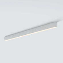 Black LUNIVA linear flush-mount light isolated at an angle on white.