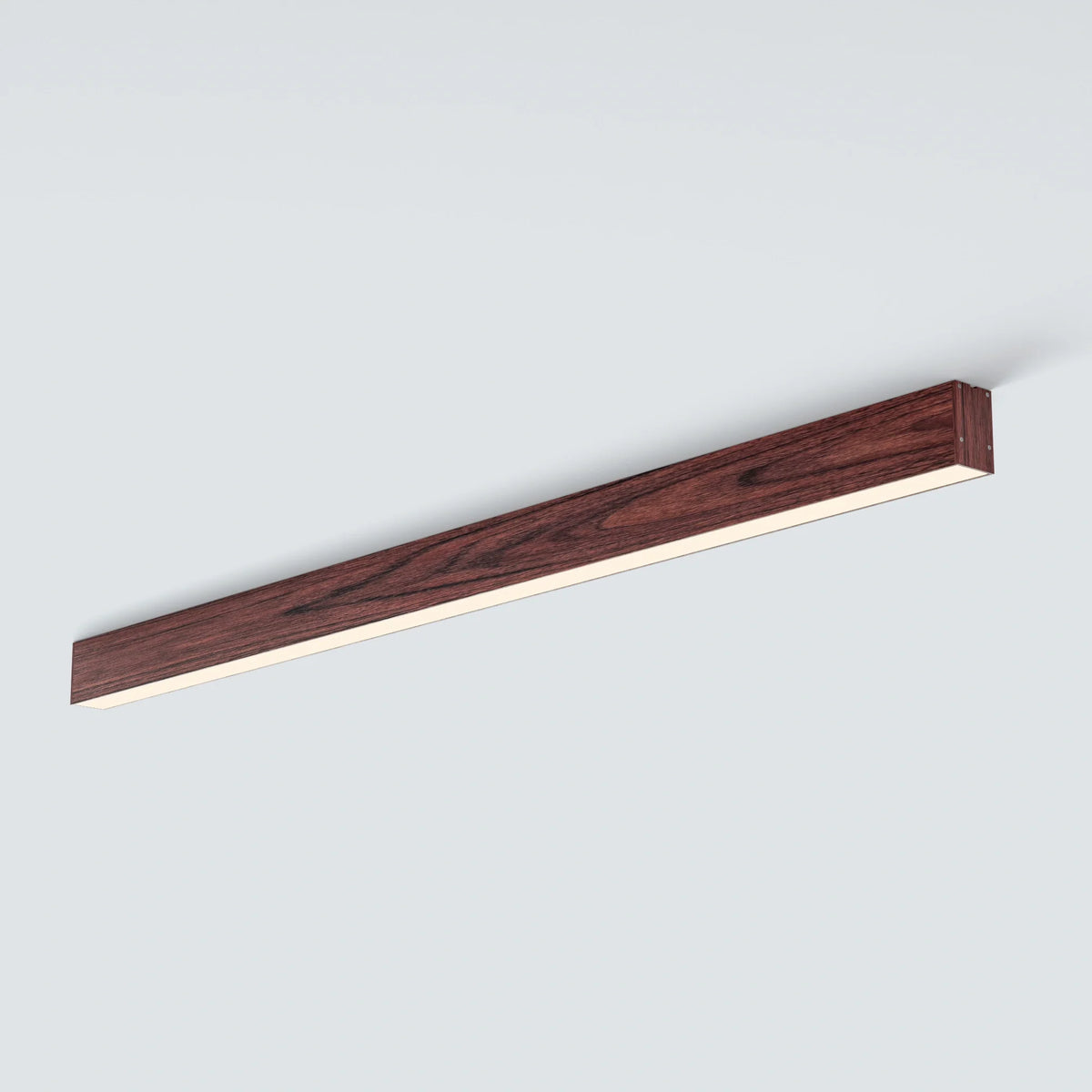 Angled LUNIVA ceiling bars meeting above a paneled contemporary living room.
