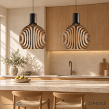 Two ABODE black wood pendants over a stone kitchen island, illustrative visualisation