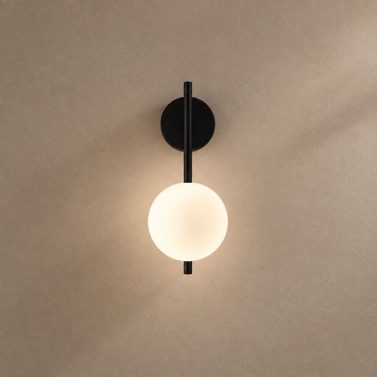 AGNUS lighting on a mushroom taupe background with natural shadows