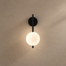 AGNUS lighting on a mushroom taupe background with natural shadows