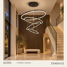 ALINA four-ring chandelier in Black above a travertine staircase with glass balustrade; photorealistic room visualization.