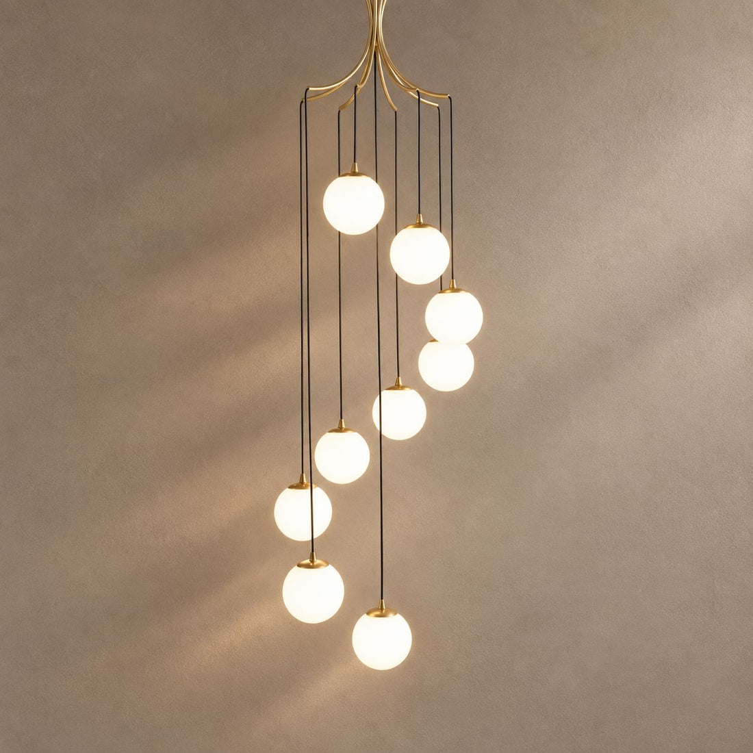 ALLIYANA lighting on a mushroom taupe background with natural shadows