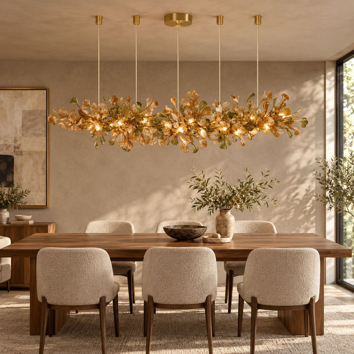 ALUNA Linear Coffee ginkgo glass chandelier above a walnut dining table