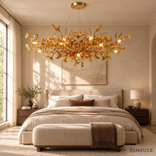 ALUNA Round Coffee chandelier in a bedroom with linen bedding and walnut furniture