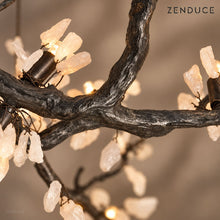 Close-up of ALVIA textured black copper branch junction and wired stone blossoms