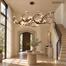 ALVIA chandelier visualization in a bright foyer with an oak staircase