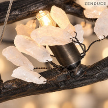 Close-up of ALVIA natural white stone petals, twisted wire attachments and G9 bulb holder