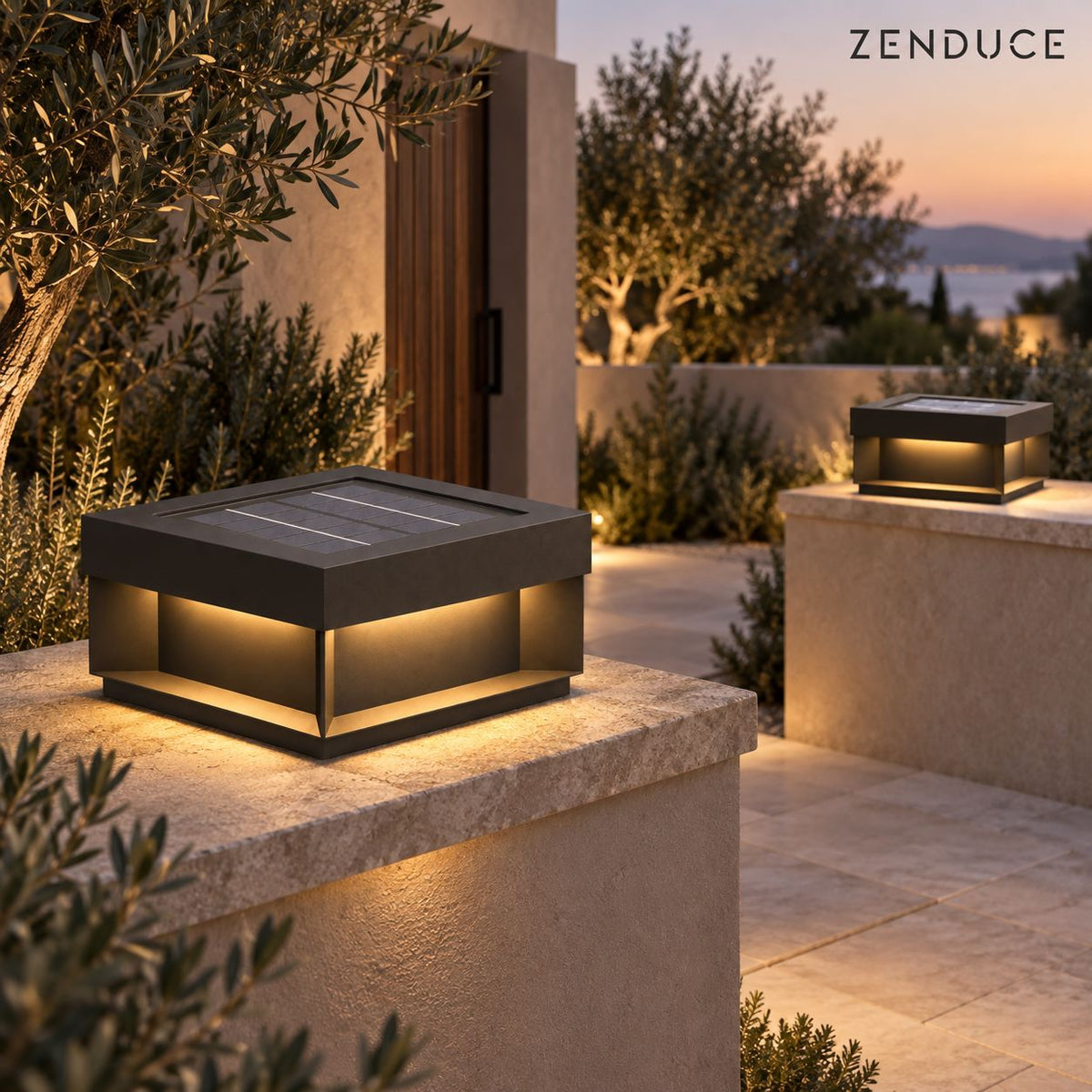 Two ALYRA solar outdoor lights on low stone walls at a warm modern entrance