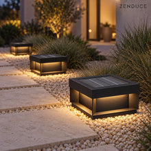 ALYRA solar lights illuminating gravel beside a garden stepping-stone path