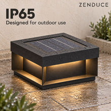 ALYRA IP65 outdoor solar light with rain droplets on its black housing and integrated solar panel