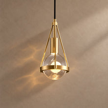 AMYA lighting on a mushroom taupe background with natural shadows